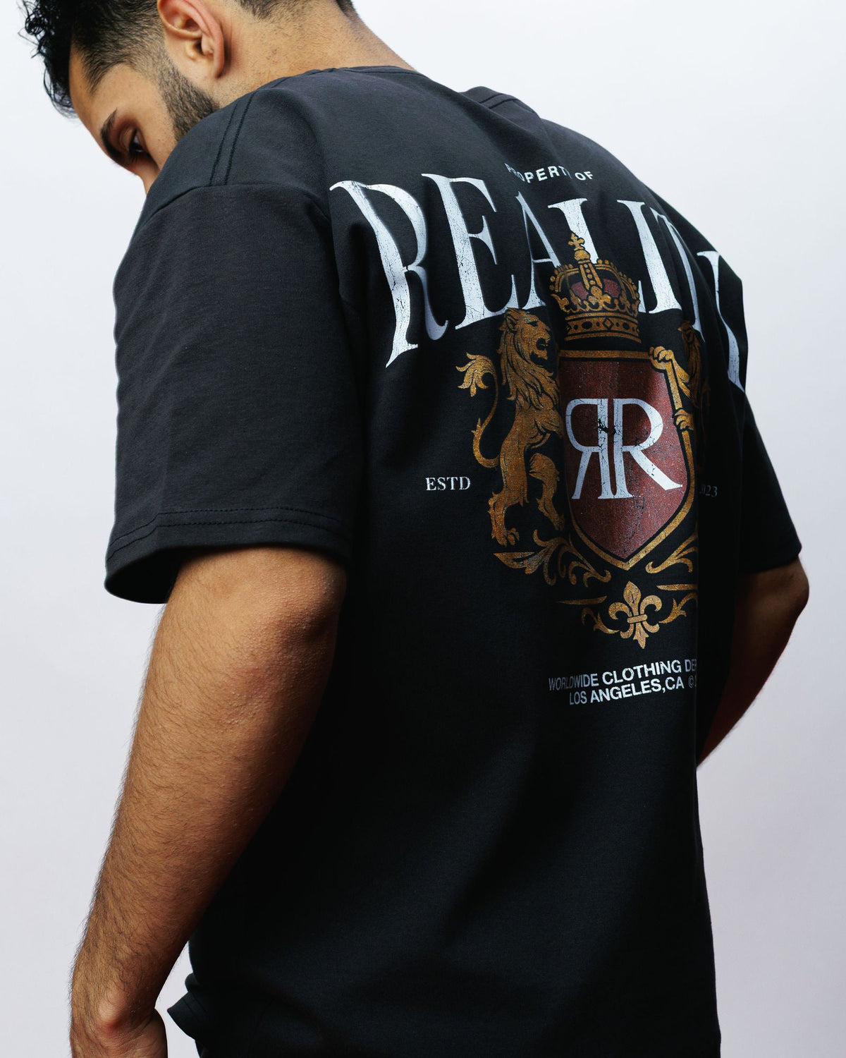 Reality Premium Crest Tee, on model