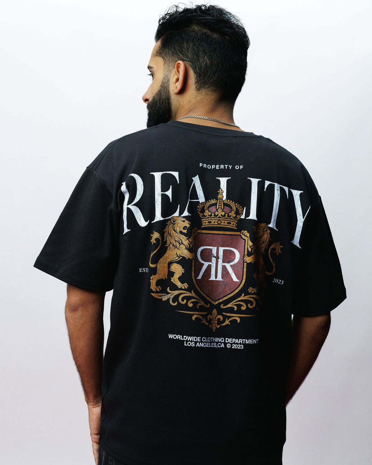 Reality Premium Crest Tee, on model