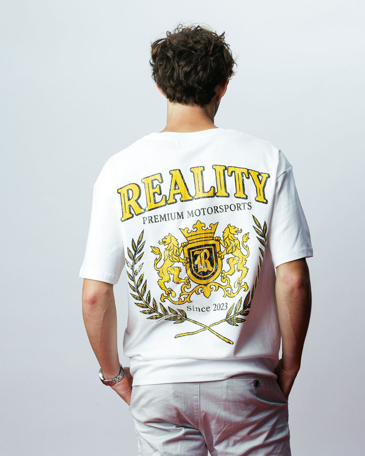 Reality Crest Tee, on model