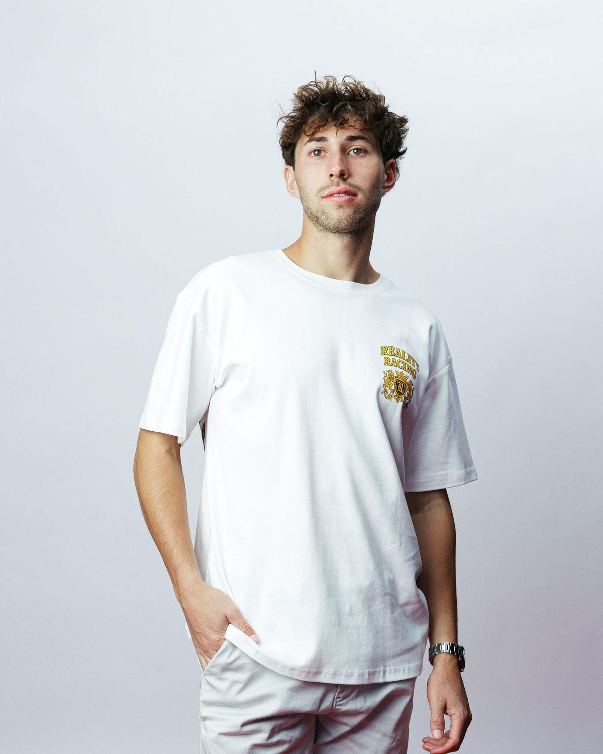 Reality Crest Tee, on model